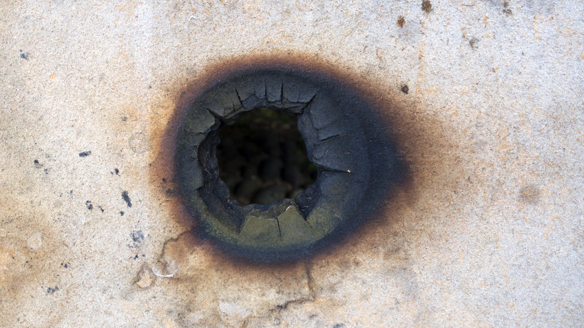 Behavioral Economics of Crime and Conflict bullet hole